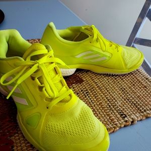 Neon yellow tennis shoes